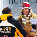 Crown Prince Haakon presents the awards after the cross country 2 x 7,5 km, where Marit Bjørgen won her second gold in these championships (Photo: Lise Åserud / Scanpix)    