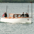 The Royal Barge takes the King and Queen ashore at Hitra (Photo: Ned Alley / NTB scanpix)