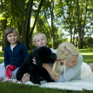 The Crown Prince and Crown Princess' family in the garden at Bygdø, enjoying their puppy Milly Kakao. Hand out picture from The Royal Court. For editorial use only - not for sale. Picture size: 6144 x 4081 px, 10,07 Mb  (Photo: Veronica Melå, The Royal Court)