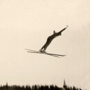 Crown Prince Olav jumping 38 meters in Holmenkollen 26 February 1923 (Photographer unknown, The Royal Court Photo Archives)