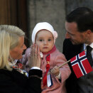 Crown Prince Haakon, Crown Princess Mette-Marit and Princess Ingrid Alexandra greet the Children's Parade at Skaugum (Photo: Jarl Fr. Erichsen / Scanpix).