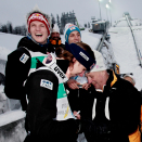 King Harald attends the ski jumping for teams, normal hill. The Austrian team wins the gold, and ask the King for his autograph (Photo: Stian Lysberg Solum / Scanpix)