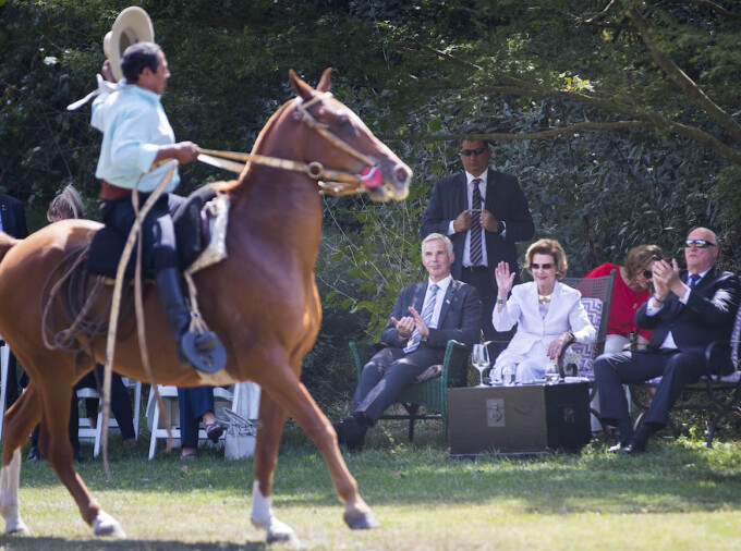 The King and Queen and Jostein Leiro - Norway´s ambassador to Argentina, watch gauchos perform at Estancia Villa María. Photo: Heiko Junge / NTB scanpix