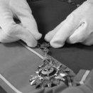 Silje Nome Schiander of the Royal Court prepares one of King Olav's orders for the exhibitions. This is the Most Illustrious Order of Chula Chom Klao - Grand Cross. Published 18.01.2012. Handout picture from the Royal Court. For editorial use only, not for sale. Photo: Liv Osmundsen / The Royal Court. Size: 3966 x 2591 px and 6,20 Mb.