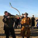 Crown Prince Haakon tested his archery skills supported by herder Gantuya  (Photo: D. Rentsendorj, Montsame news agency).